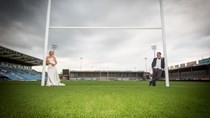 wedding couple at Sandy Park on Exeter Chiefs Rugby pitch